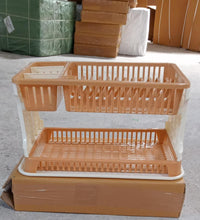 Efficient kitchen dish organizer with drainable tray.