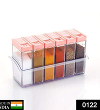 Plastic spice jars in assorted colors, arranged neatly