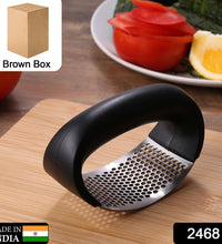 Garlic press tool for kitchen