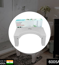 Compact and non-slip squat stool for toilet use, white color.