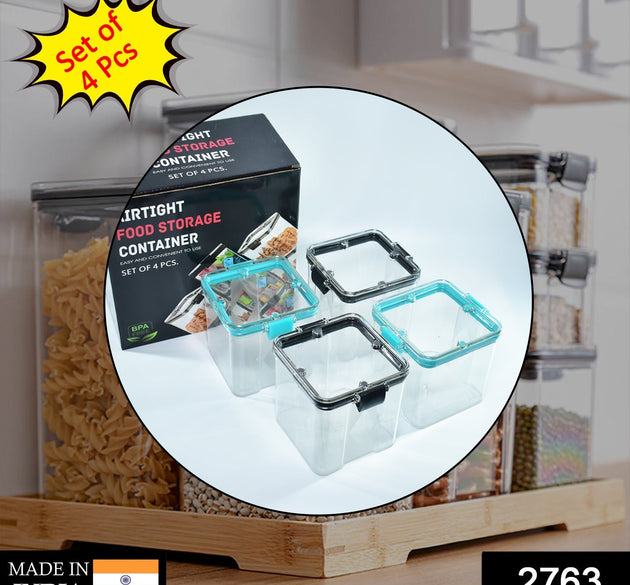 Set of four 700ml square containers, ideal for storing various food items.