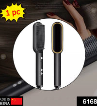 Hair straightener with adjustable temperature