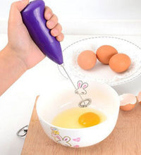 Hand blender for mixing and blending food.