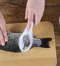 Fish scraper tool with ergonomic handle for easy use.