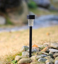 Solar LED spike light for garden, yard, or path with waterproof design.