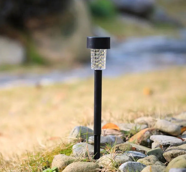 Solar LED spike light for garden, yard, or path with waterproof design.