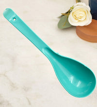 Plastic serving spoon.