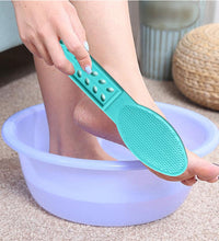 Foot scrubber with handle for pedicure.