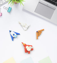 Assorted erasers in playful gun and plane designs