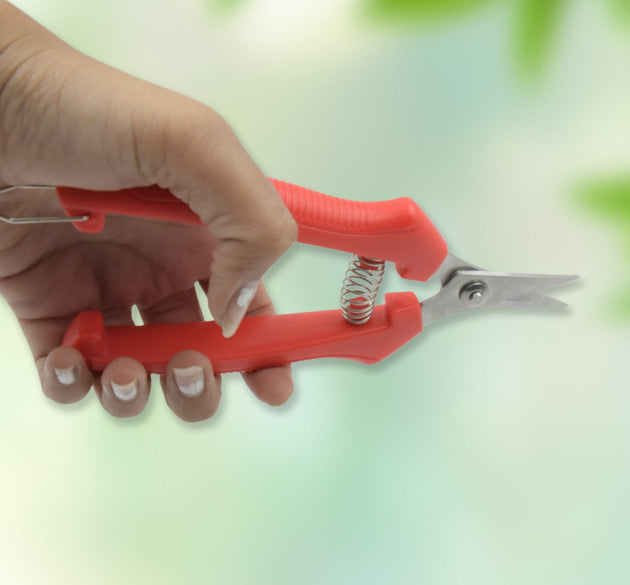 Heavy-duty stainless steel trimming scissors for gardening, designed for durability.