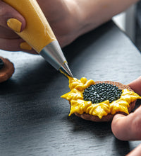 Cake decorating nozzles with piping bag