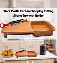 Plastic chopping board with holder for slicing and cutting.