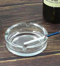 Classic crystal glass ashtray for tabletop decor.