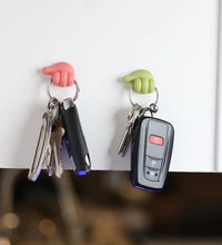 Wall clip hanger for keys with hand shape design