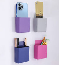 Multipurpose wall holder for storing remote and phone