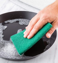 Set of 10 aqua green scrub sponges for cleaning.