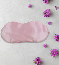 Blindfold sleep mask, satin, blocks light, ideal for meditation and travel.