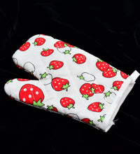 Colorful designer oven mitt and pot holder set, perfect for kitchen use.