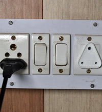 Large electric socket safety covers in various positions