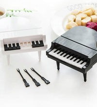 Piano-shaped snack forks for kids and adults.