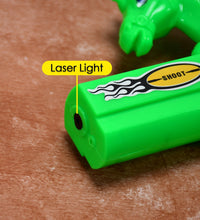 Laser light effect toy gun with musical sounds, close-up