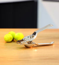 Lemon squeezer with handle.