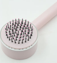 Self-cleaning detangling brush