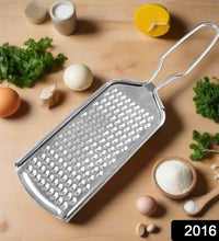 Stainless steel zester grater for zesting citrus, grating cheese, and nutmeg in the kitchen.