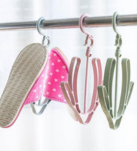 Shoe drying hanger, rotatable and ideal for hanging shoes in various settings.