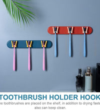 Wall-mounted toothbrush holder with compartments and hooks for bathroom use.