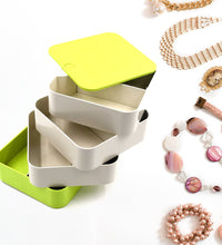 4-layer rotating jewelry box for organizing earrings and accessories.