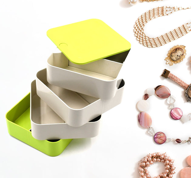 4-layer rotating jewelry box for organizing earrings and accessories.