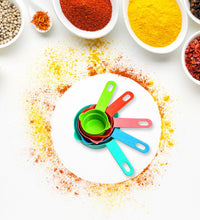 Plastic measuring spoons and cups set for home kitchen cooking