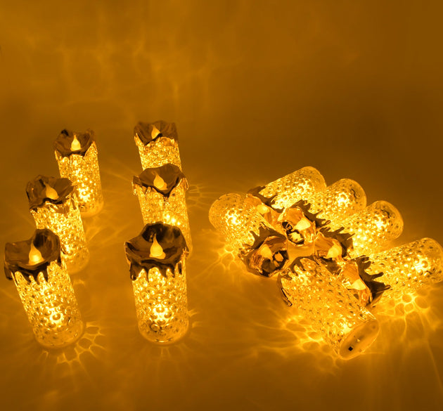 Set of gold flameless LED candles with a warm glow, ideal for home decor and special occasions.