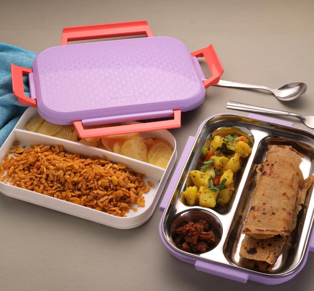 Multi-compartment lunch box with steel plates and a lid.