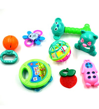 Set of sensory baby rattles with different textures and colors for infants.