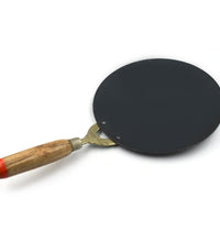 Wooden handle nonstick roti tawa for easy and efficient cooking in the kitchen.