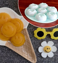 Flexible silicone mold with seven smiley cavities for baking