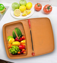 Thick plastic kitchen tray with slicing and cutting features.