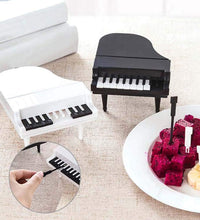 Fun kitchen accessory: piano fruit forks set.