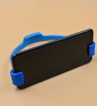 Mobile phone holder with hand shape, useful in home and office spaces.