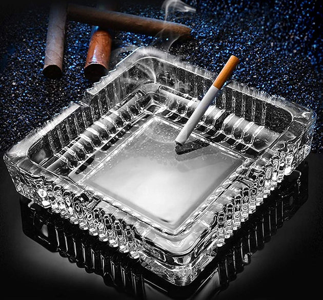 Square crystal ashtray for cigars and cigarettes.