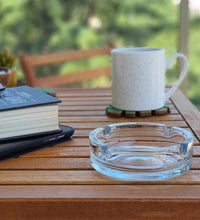 Elegant crystal ashtray with a smooth finish.