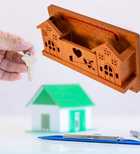 Wooden hooks for organizing keys.