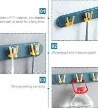 Wall-mounted bathroom shelf with hooks, ideal for organizing toothbrushes.