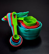 Measuring spoons and cups set in plastic for various kitchen tasks