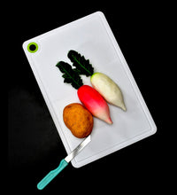 Plastic cutting board, ideal for chopping veggies and fruits