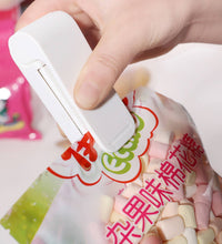 Handheld plastic bag heat sealer