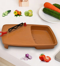 Thick plastic kitchen chopping board with holder.