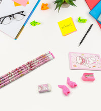 Kids' stationery kit with wooden pencils and sharpener.